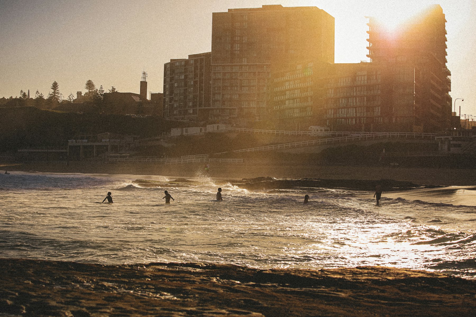 Surfers in the water off the Newcastle coastline, New South Wales